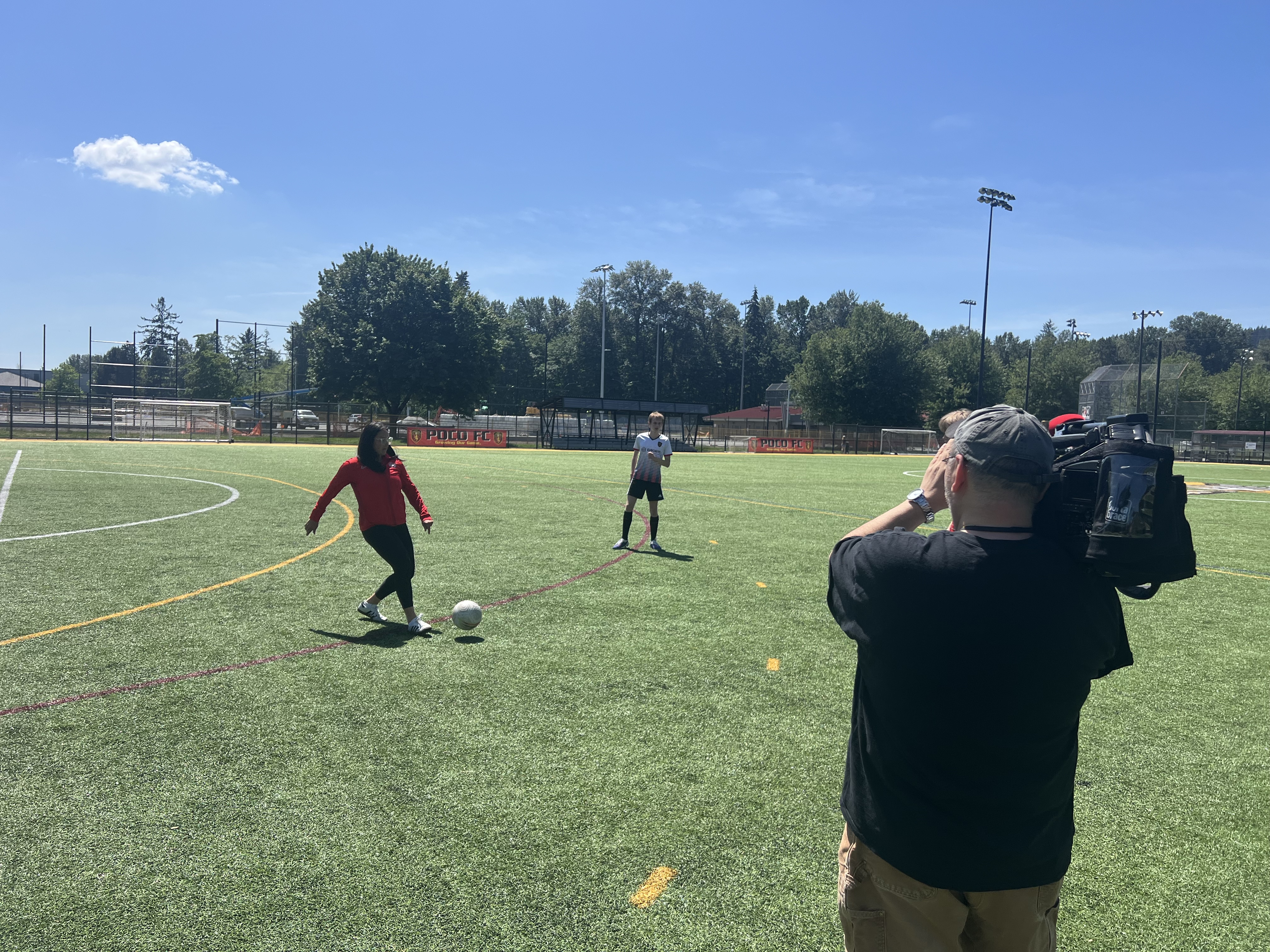 Dehara with youth players for CBC interview at Gates Park