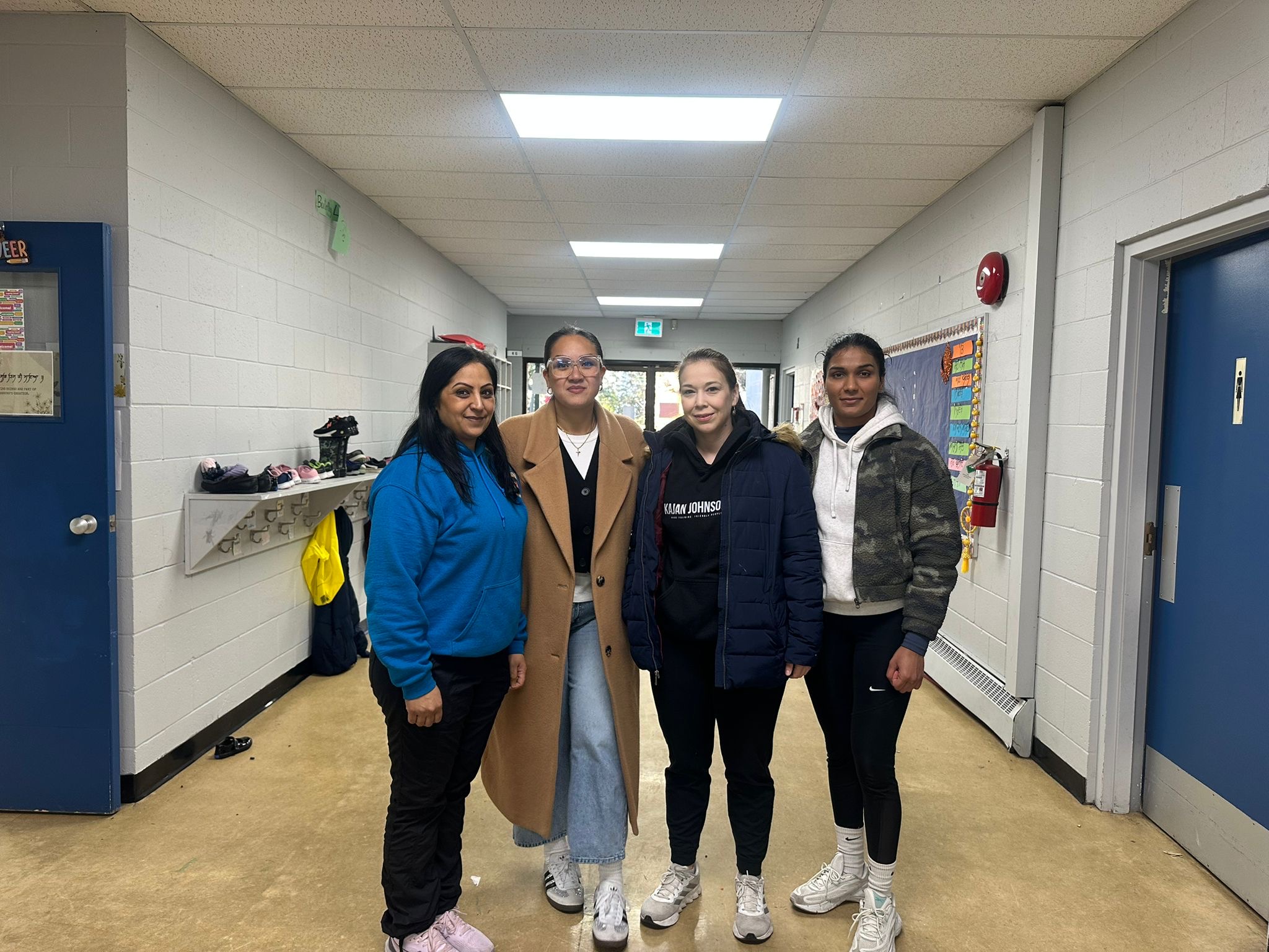 Dehara with parents at school hallway